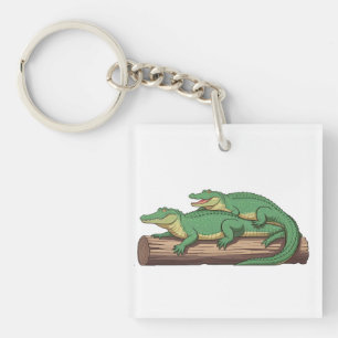 Porte-clefs un groupe d'alligators qui se sunnisent sur un ron