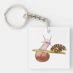 Porte-clefs Un mignon escargot de dessin sur un Plante avec un