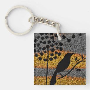 Porte-clefs Un oiseau parmi les plumes