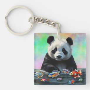 Porte-clefs Un panda regarde curieusement des poissons colorés