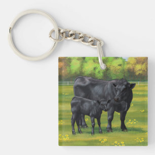 Porte-clefs Vache d'Angus noir et veau mou en pâturage d'été