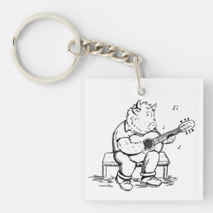 Porte-clefs Vache des Highlands jouant de la guitare acoustiqu