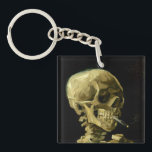 Porte-clefs Van Gogh Fumer du squelette<br><div class="desc">Porte - clé représentant la peinture à l’huile de Vincent van Gogh,  Skull of a Skeleton with Burning Cigarette (1885-86). Un grand cadeau pour les amateurs de post-impressionnisme et d'art hollandais !</div>