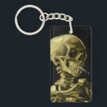 Porte-clefs Van Gogh Fumer du squelette<br><div class="desc">Porte - clé représentant la peinture à l’huile de Vincent van Gogh,  Skull of a Skeleton with Burning Cigarette (1885-86). Un grand cadeau pour les amateurs de post-impressionnisme et d'art hollandais !</div>