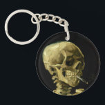Porte-clefs Van Gogh Fumer du squelette<br><div class="desc">Porte - clé représentant la peinture à l’huile de Vincent van Gogh,  Skull of a Skeleton with Burning Cigarette (1885-86). Un grand cadeau pour les amateurs de post-impressionnisme et d'art hollandais !</div>