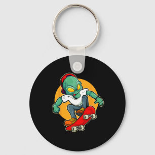 Porte-clés Alien faisant du skateboard Ufo extraterrestre pla