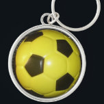 Porte-clés Art de football (soccer) jaune et noir vibrant<br><div class="desc">Art de football vibrant jaune et noir</div>
