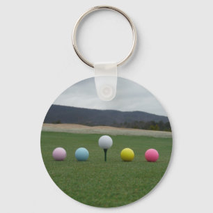 Porte-clés Ballons de golf aux couleurs vives sur une montagn