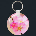 Porte-clés Beautiful Sakura Cherry Blossoms<br><div class="desc">Three fresh, newly-born sakura flowers - Japanese cherry blossoms on a thin tree twig against the stunning pink background. Cherry garden at the peak of Hanami - sakura watching - season. A digital painting from a photograph. Colorful and elegant keychain for anyone. Customizable. You can change the image and you...</div>