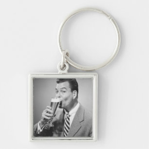 Porte-clés Bière potable d'homme d'affaires