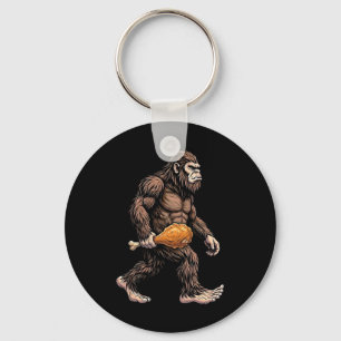 Porte-clés Bigfoot portant un pilon de poulet amant Sasquatch