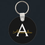 Porte-clés Black Gold Modern Script Girl Monogramme Nom<br><div class="desc">Noir et or Simple Script Monogramme Nom Clés (Porte - clé). Cela rend le cadeau parfait pour 16 ans,  mariage,  douche nuptiale,  anniversaire,  baby shower ou bachelorette pour quelqu'un qui aime le luxe glam et les styles chic.</div>