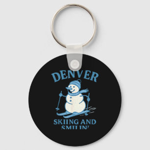 Porte-clés Bonhomme de neige qui skie et sourit à Denver Colo