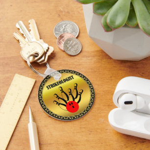 Porte-clés Boule de bowling et épingles avec le mot STRIKEOLO