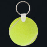 Porte-clés Boule de tennis personnalisable<br><div class="desc">C’est l’heure du jeu ! Ce ballon de tennis jaune-vert a l'air assez réel pour piller sur le filet. Si vous êtes un vrai joueur de tennis ou que vous aimez simplement jouer à la partie, vous apprécierez cette image floue de balle de tennis. Remarque : N'hésitez pas à vous...</div>