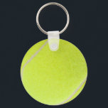 Porte-clés Boule de tennis personnalisable<br><div class="desc">C’est l’heure du jeu ! Ce ballon de tennis jaune-vert a l'air assez réel pour piller sur le filet. Si vous êtes un vrai joueur de tennis ou que vous aimez simplement jouer à la partie, vous apprécierez cette image floue de balle de tennis. Remarque : N'hésitez pas à vous...</div>
