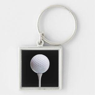 Porte-clés Boule et pièce en t de golf sur le noir - modèle
