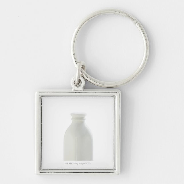 Porte-clés Bouteille à lait sur l'arrière - plan blanc (Devant)
