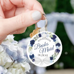 Porte-clés Bridesmaid Blue Watercolor Floral Wreath Wedding<br><div class="desc">These keychains are designed to give as favors to bridesmaids in your wedding party. They feature a rustic hand painted watercolor design with a wreath of roses and flowers in shades of dusty blue, navy and indigo. The text is written in elegant script letters, and there is room for her...</div>