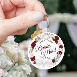 Porte-clés Bridesmaid Elegant Red Floral Wreath Wedding<br><div class="desc">These keychains are designed to give as favors to bridesmaids in your wedding party. They feature a rustic hand painted watercolor design with a wreath of roses and flowers in shades of red, burgundy, and blush pink. The text is written in elegant script letters, and there is room for her...</div>