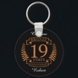 Porte-clés Bronze traditional wedding anniversary 19 years<br><div class="desc">A design to celebrate 19 years of marriage. This design has a bronze colored laurel design on a black background. Bronze is the traditional gift for this occasion. The text reads bronze 19 years anniversary. A romantic design to celebrate your 19th year of marriage. If you would like any help...</div>