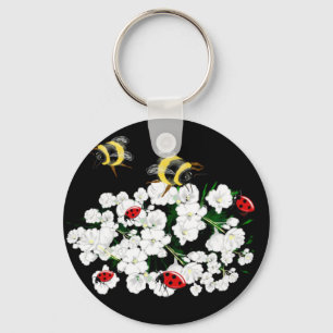 Porte-clés Bureaux d'abeilles dramatiques et fleurs blanches 