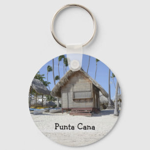 Porte-clés cabane d'herbe sur une plage tropicale