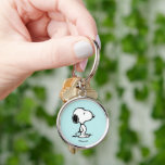 Porte-clés cacahuètes | Snoopy<br><div class="desc">Snoopy est l'adorable beagle de Charlie Brown dans la bande dessinée Peanuts de Charles M. Schulz. Découvrez ce joli dessin de cacahuètes avec ce chien adorable.</div>