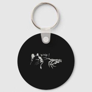 Porte-clés Chat noir Squelette Main Boop sur le nez d'un chat