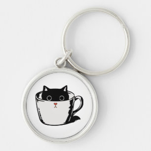 Porte-clés Chaton noir avec nez rouge caché dans une tasse