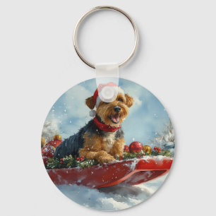 Porte-clés Chien Airedale en traîneau Laissez tomber la neige