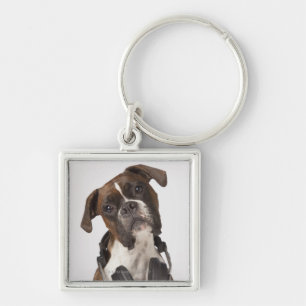 Porte-clés chien de boxeur avec des écouteurs