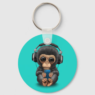 Porte-clés Chimpanzé de bébé avec les écouteurs et le