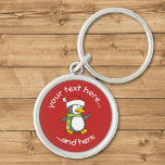 Porte-clés Christmas Penguin Walking on Snow Keychain<br><div class="desc">A little penguin cartoon with santa hat and green scarf walking on snow. Custom background color. Custom text.</div>