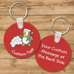 Porte-clés Christmas Penguin with Snow Balls Waving Keychain<br><div class="desc">A little penguin cartoon with santa hat and green scarf waving in front of a snowball stack. Custom background color. Custom text on both sides.</div>