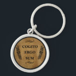 Porte-clés cogito ergo sum, expression latine<br><div class="desc">Cogito, ergo sum est une déclaration philosophique qui a été faite en latin par René Descartes, généralement traduit en anglais comme "Je pense, donc je suis". L'expression est apparue à l'origine en français comme je pense, donc je suis dans son Discours sur la Méthode, afin d'atteindre un public plus large...</div>