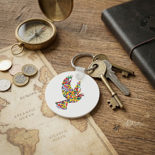 Porte-clés Colombe de la paix mondiale faite de drapeaux inte