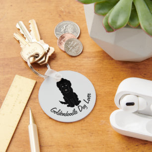 Porte-clés Conception de Goldendoodle noir sur fond de couleu