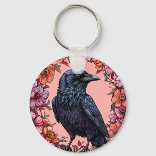 Porte-clés Corbeau noir entouré de fleurs roses et orange