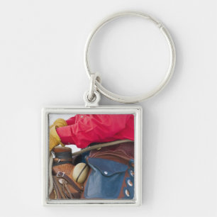 Porte-clés Cow-boy à cheval portant des chaps en cuir