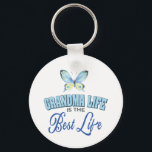 Porte-clés Custom Photo Grandma<br><div class="desc">Celebrate grandma pride with this custom photo Grandma keychain featuring your favorite photo, a soft watercolor butterfly, and elegant typography that reads “Grandma Life Is The Best Life.” This personalized keepsake is a meaningful gift for grandmas who cherish family, love deeply, and carry their sweetest memories wherever they go. Celebrate...</div>