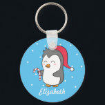 Porte-clés Cute Christmas Penguin Candy Cane Kids Keychain<br><div class="desc">A cute penguin design for the little ones. It has a cartoon of a cute and happy penguin holding on to a candy cane and wearing a Christmas cap. Put a smile on your little one's face with this delightful design. Personalise with child's name.</div>