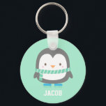 Porte-clés Cute Little Penguin with Winter Scarf Personalized<br><div class="desc">A keychain with a cute little penguin with a green stripes winter scarf and a pair of blue skates. Mint background colour can be changed. Great as a mini gift or Christmas stocking fillers! Personalise with child's name.</div>