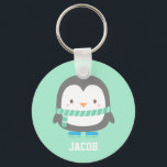 Porte-clés Cute Little Penguin with Winter Scarf Personalized<br><div class="desc">A keychain with a cute little penguin with a green stripes winter scarf and a pair of blue skates. Mint background colour can be changed. Great as a mini gift or Christmas stocking fillers! Personalise with child's name.</div>