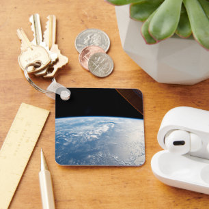 Porte-clés Des Poutres De Soleil Au Bord Des Eaux De L'Océan 