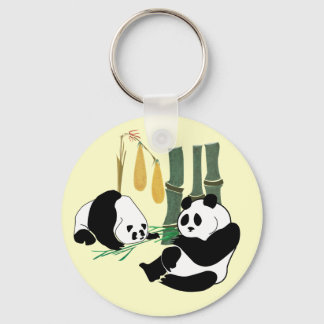 Porte-clés Deux mignons Pandas mangent du bambou dans la forê