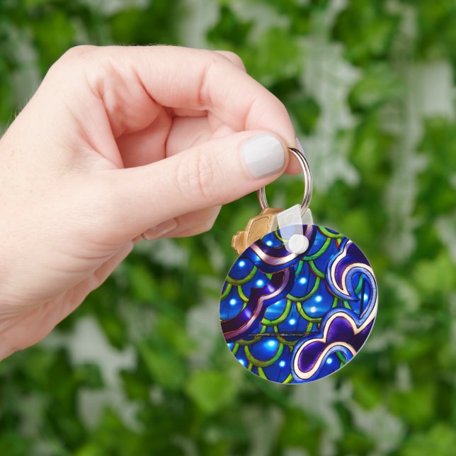 Porte-clés Écailles Bleues Lumineuses  (main)