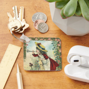 Porte-clés Enfant victorienne vintage, fille soufflant dans u