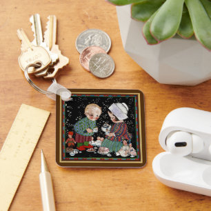 Porte-clés Enfants vintages ayant une tasse de thé