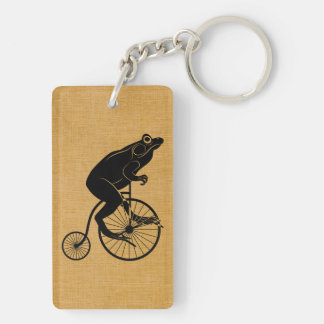 Porte-clés Équitation de grenouille sur un vélo de quart de